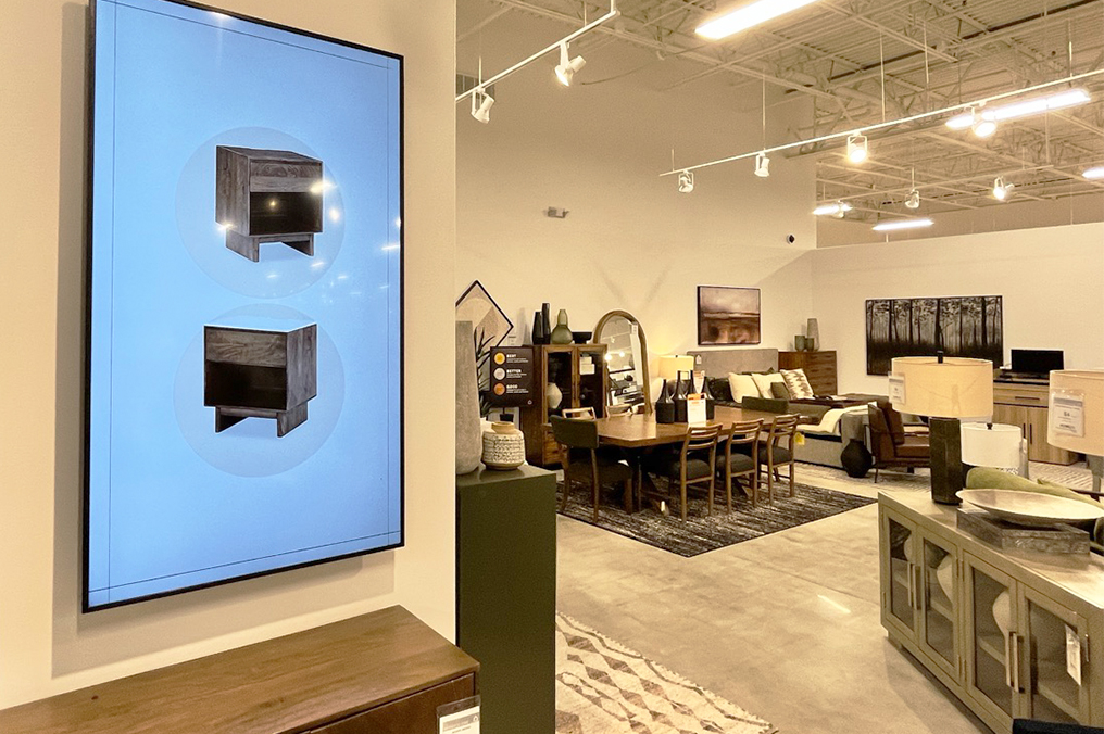 Tv screen on wall in section of Ashley Furniture Homestore location in Gurnee Chicagoland construction